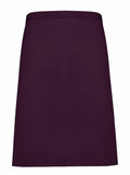 A plain, dark purple knee-length skirt by Premier, featuring a simple waistband, displayed against a white background.