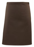 A plain, dark brown knee-length A-line skirt labeled as PR151 by Premier is featured against a white background. The skirt includes a straightforward waistband and lacks any visible patterns or embellishments.