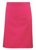 The Premier PR151 is a vibrant pink skirt featuring a simple, straight cut design. It has a smooth texture and is free of any visible patterns or embellishments.