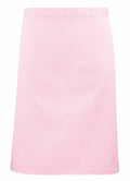 Introducing the Premier PR151: a plain pink A-line skirt with a sleek, slightly shiny texture. This elegant skirt falls above the knee and features a minimalist waistband, free of any visible patterns or embellishments.
