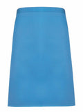 The Premier PR151 is a straightforward, knee-length blue skirt featuring a straight design with a waistband. The fabric is smooth, and the skirt is free from visible patterns or embellishments.