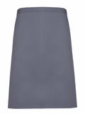 The PR151 by Premier is a dark gray, plain A-line skirt featuring a simple waistband. The fabric has a smooth and lightweight appearance.