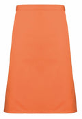 The PR151 by Premier is a minimalist orange waist apron that features a sleek design without visible pockets or embellishments.