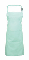 The Premier PR154 is a light teal apron featuring an adjustable neck strap and a front pocket.