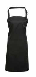The Premier PR154 apron in black, featuring an adjustable neck strap and a front pocket, is displayed against a plain white background.