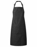 A Premier PR154 denim apron in black, featuring an adjustable neck strap and a spacious front pocket.