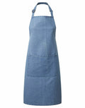 The PR154 by Premier is a blue denim apron featuring an adjustable neck strap and a spacious front pocket.