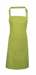 A Premier lime green apron (Product Name: PR154) is featured against a white background, showcasing its adjustable neck strap and large front pocket. The fabric appears smooth and sturdy, making it ideal for cooking or crafting activities.
