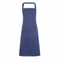 The Premier PR154 is a plain blue apron featuring an adjustable neck strap and a large front pocket, showcased against a white background.