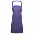 Displayed is Premier's PR154 apron, featuring a neck strap and an adjustable waistband. It includes a spacious central pocket, and its fabric seems to be smooth and durable, ideal for kitchen or craft activities.