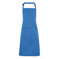 The Premier PR154 is a plain blue apron with a neck strap and waist ties. It features a large rectangular pocket on the front and is showcased against a white background.