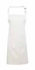 Premier's PR154 apron in plain white features adjustable straps and a convenient front pocket.
