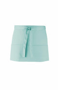 A Premier PR155 apron in turquoise, featuring a front tie and pockets.