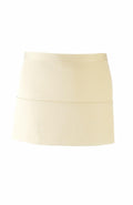 The PR155 by Premier is a plain cream mini skirt set against a white background, highlighting its simple and minimalist design.