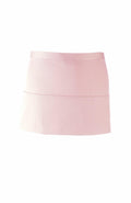 Introducing the Premier PR155 apron: a light pink design with a sleek and simple look, featuring a convenient waistband and a small front pocket. The fabric is smooth and lightweight, perfect for any task.
