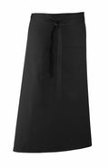 A Premier PR158 waist apron in black, featuring a front pocket and tie straps.