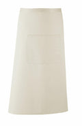 The Premier PR158 is a plain beige waist apron featuring a front pocket, set against a white background. Its simple, classic design makes it perfect for culinary or craft activities.