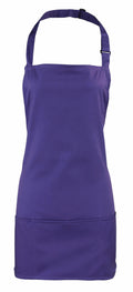 An apron marked as PR159, which comes in plain purple and features an adjustable neck strap and front pockets, is from the Premier brand.