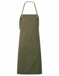 The Premier PR181 apron in dark green features an adjustable neck strap and a large front pocket, showcased against a white background.