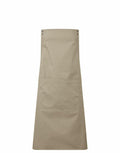 A plain beige apron labeled as PR190 from the brand Premier features two riveted straps and a large front pocket, showcased against a white background.