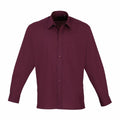 A Premier PR200 maroon long-sleeve shirt featuring a button-up design and a pocket on the left chest.