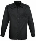 The Premier PR200 is a classic black button-up long-sleeve shirt featuring a front pocket and collar.