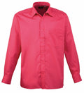 Premier's PR200 is a vibrant pink long-sleeve shirt featuring a button-up front, collar, and single chest pocket.