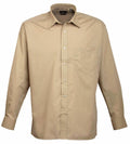 The Premier PR200 is a beige, long-sleeved button-up shirt featuring a single breast pocket, neatly displayed against a plain white background.