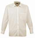 The Premier PR200 is a cream-colored, long-sleeve button-up shirt featuring a pointed collar and a chest pocket, showcased against a plain white background.