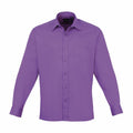 A Premier PR200 long-sleeved button-up shirt in purple, featuring a front pocket and displayed against a plain white background.
