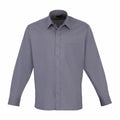 A neatly pressed, long-sleeved Premier PR200 gray dress shirt featuring a button-up front and a single breast pocket on the left side is displayed against a plain white background.