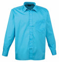 A Premier PR200 shirt in bright blue, featuring long sleeves, a pointed collar, and a chest pocket on the left side.