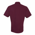 The Premier PR202 shirt features a simple design with short sleeves and a maroon color, shown from the back.