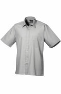 Product PR202 from Premier features a gray short-sleeved button-up shirt with a collar and chest pocket, showcased against a plain white background.