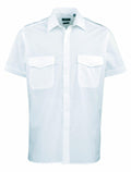 Premier's PR212 is a white short-sleeve button-up shirt featuring two front pockets and a collar.