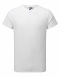 A Premier PR219 plain white short-sleeve, button-up T-shirt is displayed against a white background. This shirt features a round neckline and a minimalistic design.