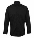 Premier's PR234 is a black button-up shirt featuring a collar and long sleeves, displayed against a white background.