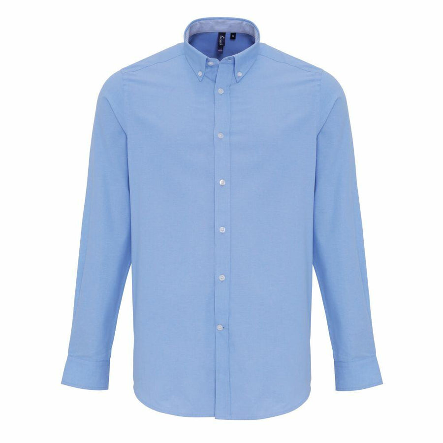 The Premier PR238, a light blue, long-sleeve button-up shirt with a button-down collar, is displayed against a white background.