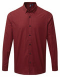 Premier's PR252 long-sleeve button-up shirt in a red and black checkered pattern.