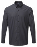 The Premier PR252 is a long-sleeved, button-up shirt showcasing a black and gray checkered pattern, complete with a classic collar and a straight hem.