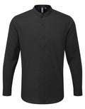 A Premier PR258 shirt, featuring a black color, long sleeves, a button-up design, and a band collar, is displayed on a plain background.
