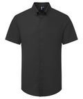 The image shows a black, short-sleeve, button-up shirt with a collar from the Shirts collection. The plain design has no visible patterns and features front buttons. Displayed against a white background.