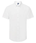 The Shirts product is a plain white, short-sleeve button-up with a collar, displayed on a white background. It features a simple design with no patterns or visible logos.