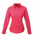The PR300 shirt by Premier is a vibrant pink, long-sleeved button-up with a classic collar, elegantly showcased against a white background.