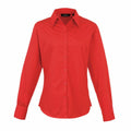 The PR300 by Premier is a long-sleeved button-up shirt in red. It features a collar and appears to be crafted from cotton or a similar fabric, showcased against a white background.