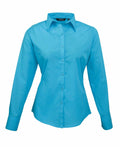 The PR300 by Premier is a fitted long-sleeve button-up shirt in bright blue, featuring a pointed collar, shown against a white background.