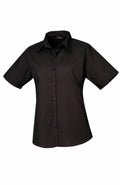 The PR302 short-sleeve black button-up shirt by Premier displayed on a plain white background.