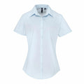 Premier's PR309 shirt is a light blue, short-sleeve button-up with a pointed collar, showcased on a white background.