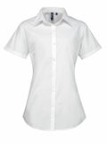 A Premier PR309 white, short-sleeved, collared button-up shirt showcased against a plain background.