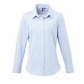 The Premier PR320 is a light blue, long-sleeved button-up shirt featuring a collar and small white buttons. It has a tailored fit with a subtle grid pattern.